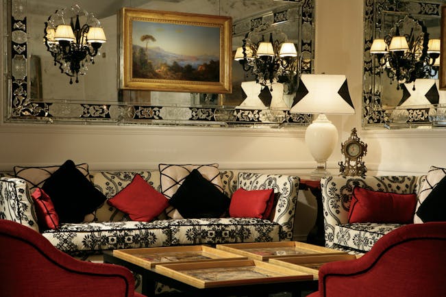 Hotel d'Inghilterra Rome lobby indoor seating area sofas armchairs ornate decor 