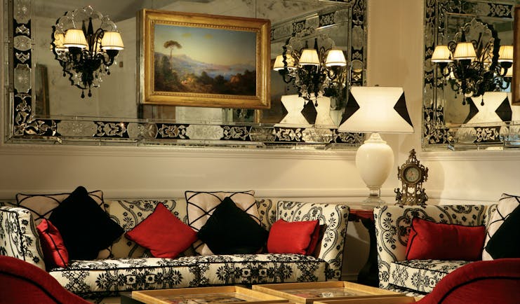 Hotel d'Inghilterra Rome lobby indoor seating area sofas armchairs ornate decor