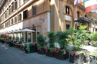 Hotel d'Inghilterra Rome street terrace outdoor dining area umbrellas