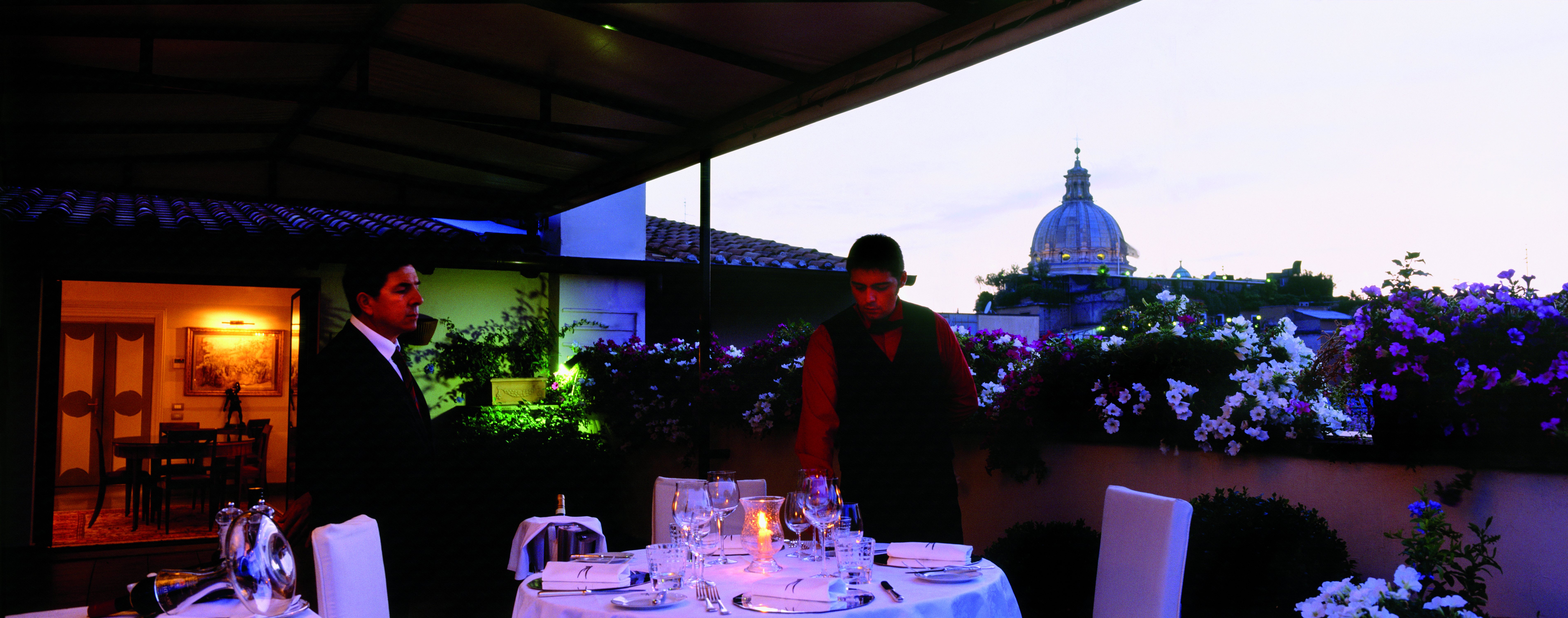 Hotel d'Inghilterra Rome terrace dining table set for two waiters city views