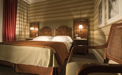 Hotel Mascagni Rome classic room double bed armchair modern décor