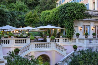 Hotel de Russie Rome terrace pink building and shades