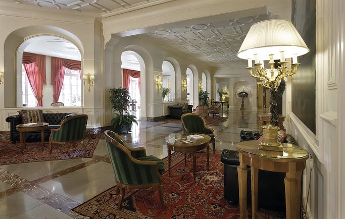 Grand Hotel Sitea Turin lobby hall with seating and antique lights