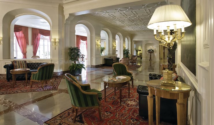 Grand Hotel Sitea Turin lobby hall with seating and antique lights