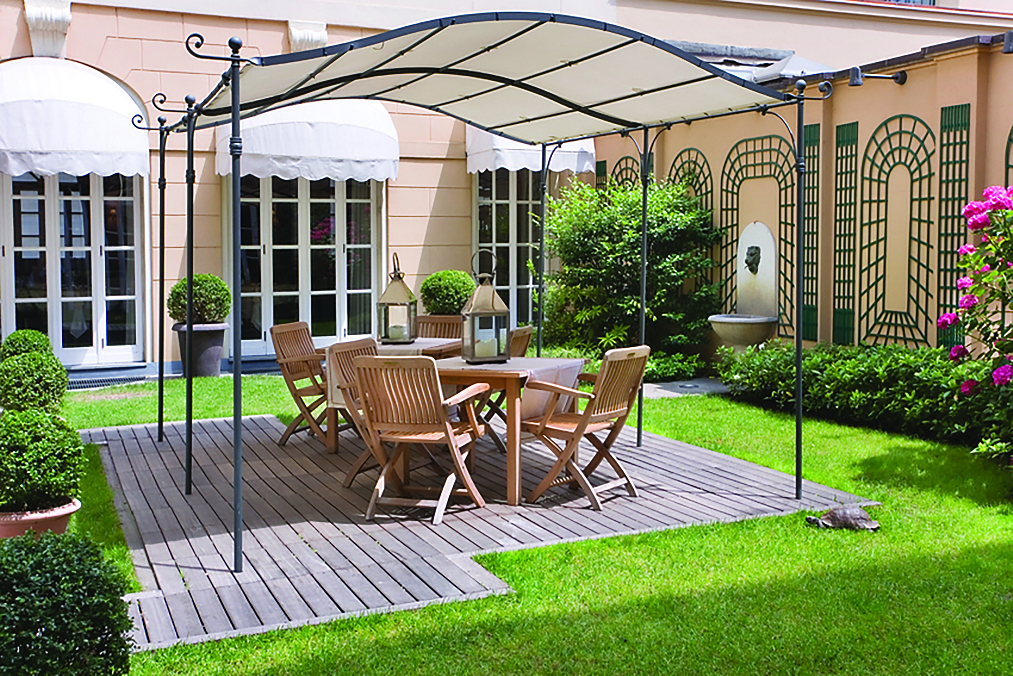Grand Hotel Sitea Turin garden area with shade and chairs by grass