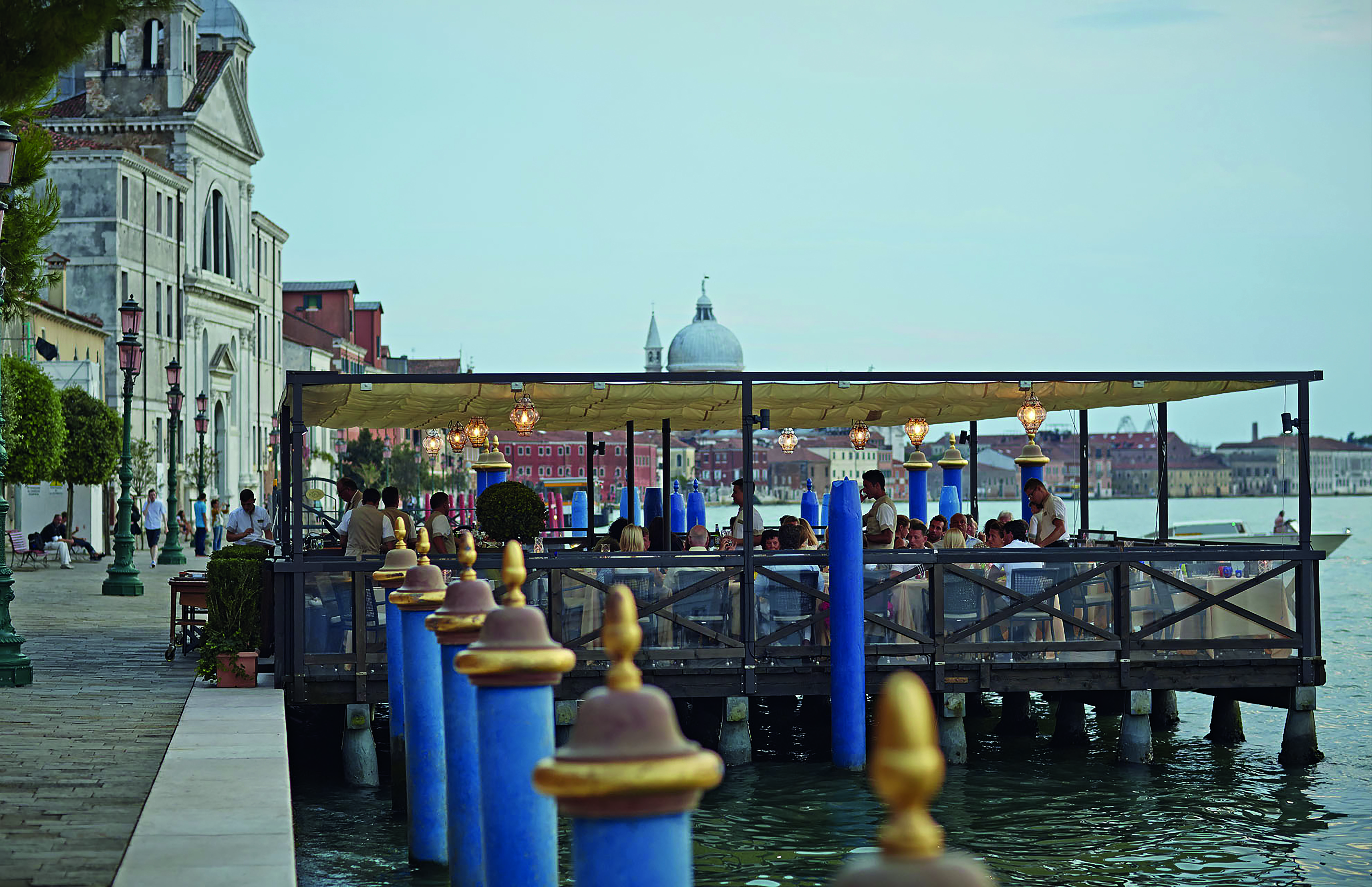 Belmond Hotel Cipriani outdoor dining area on a platform above the water