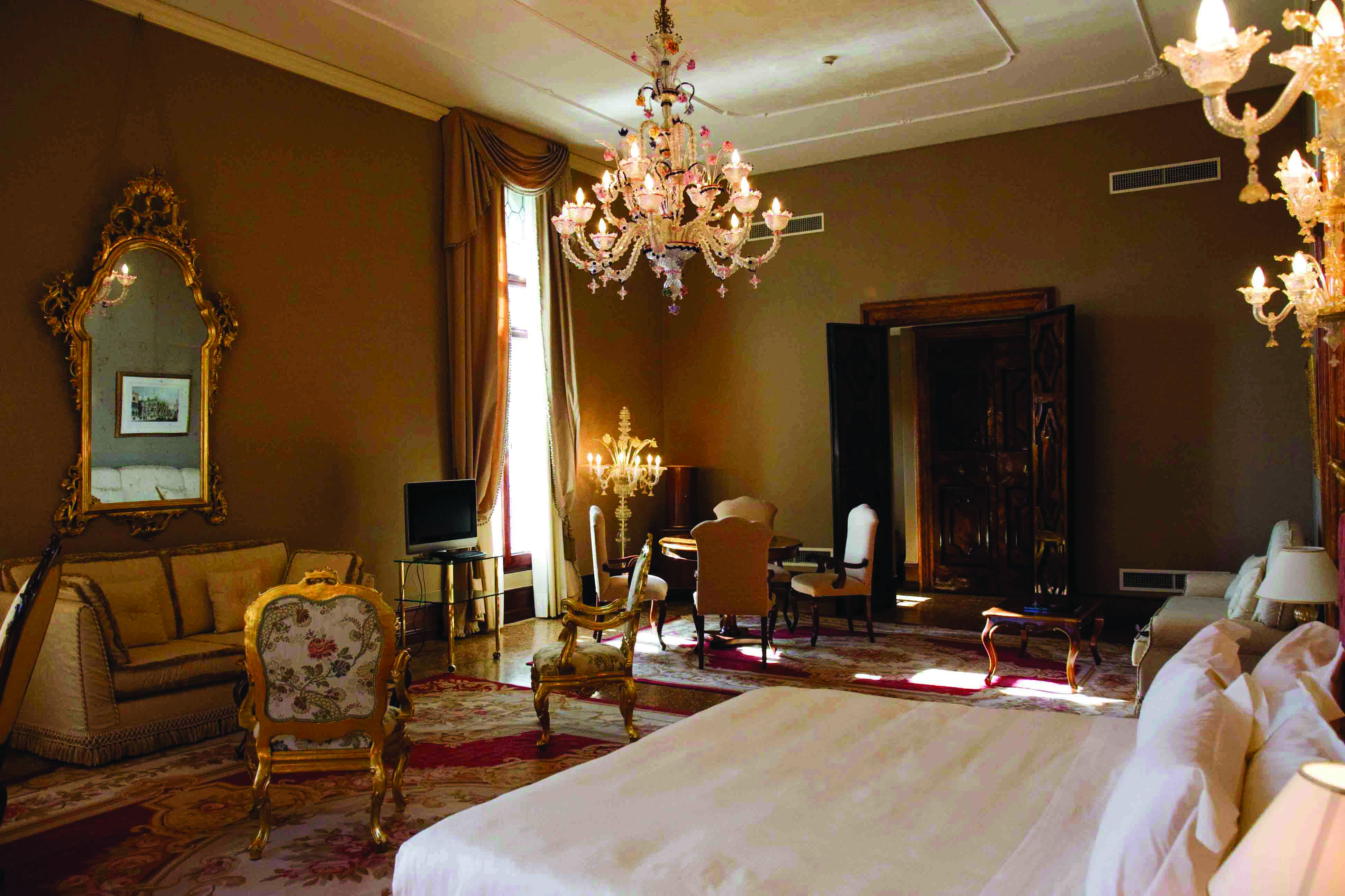 Ca Sagredo Venice presidential suite bed large lounge area candelabra