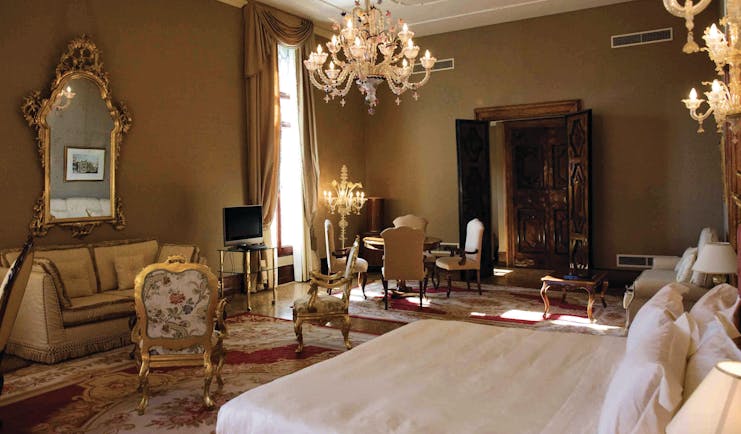 Ca Sagredo Venice presidential suite bed large lounge area candelabra