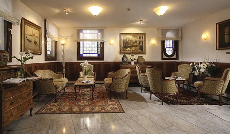 Hotel Bizansio Venice lobby sofas dining chairs indoor seating area