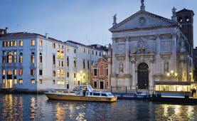 Palazzo Giovanelli Venice hotel building on canal front adjacent to church