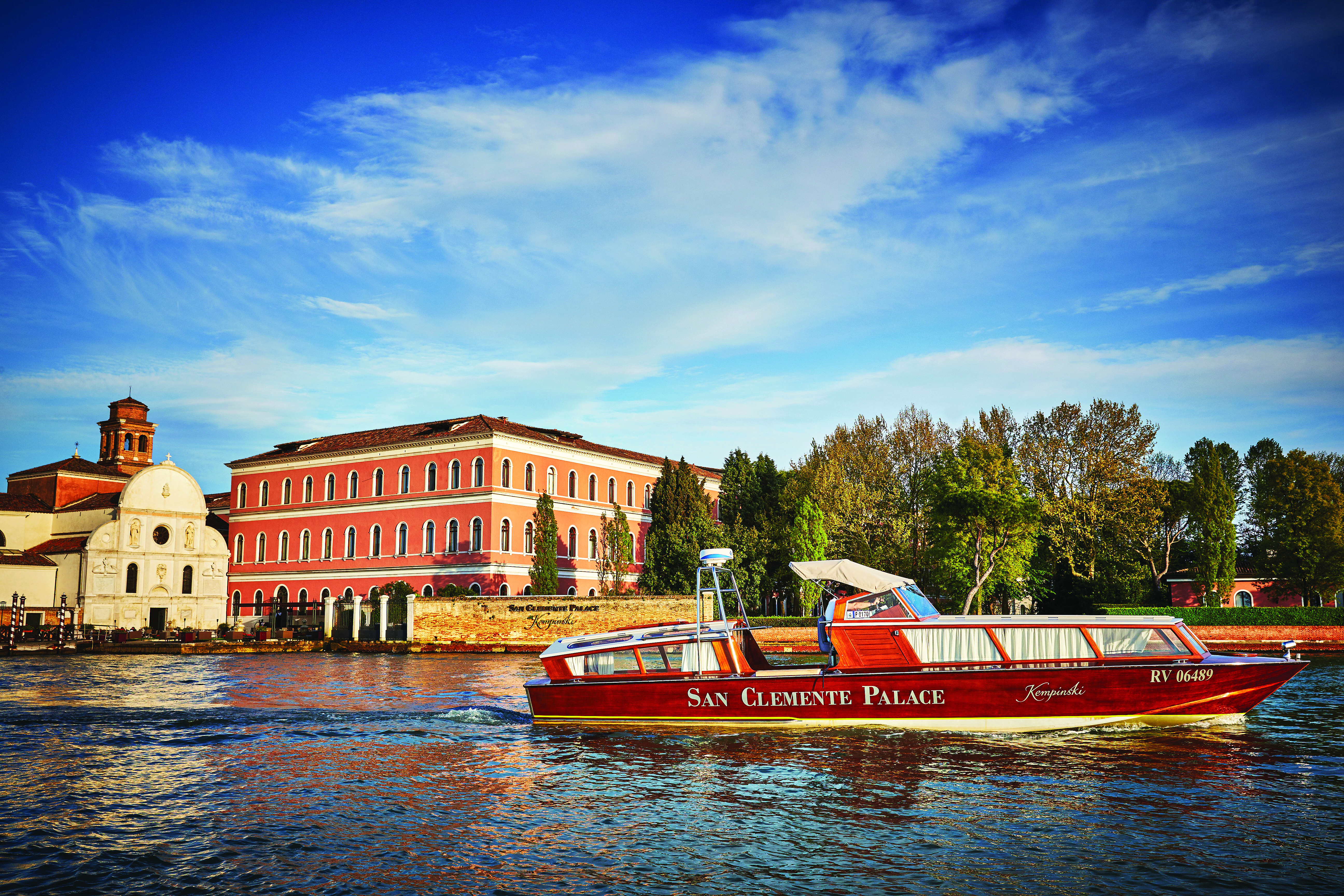 San Clemente Palace Venice hotel exterior view from canal boat on water