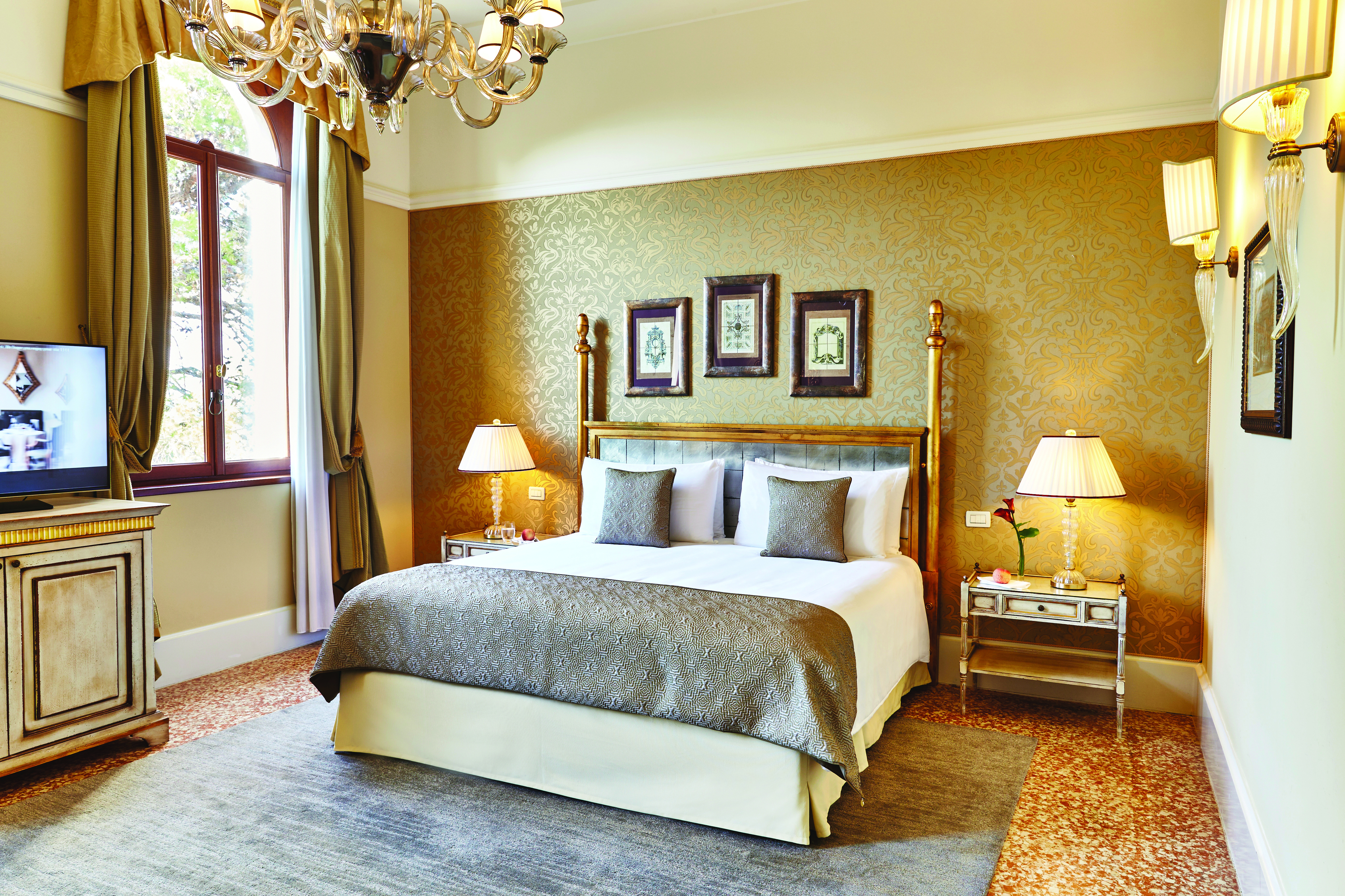 San Clemente Palace Venice lagoon suite bedroom bed television