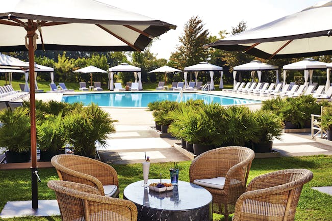 San Clemente Palace Venice pool sun loungers umbrellas outdoor dining area