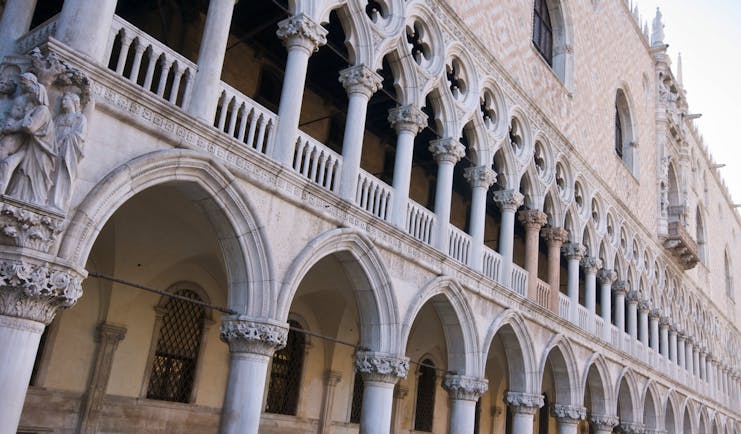 Pink marble ornate exterior of Doge's Palace in Venice