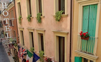 Hotel Giulietta e Romeo Verona hotel building exterior traditional architecture international flags