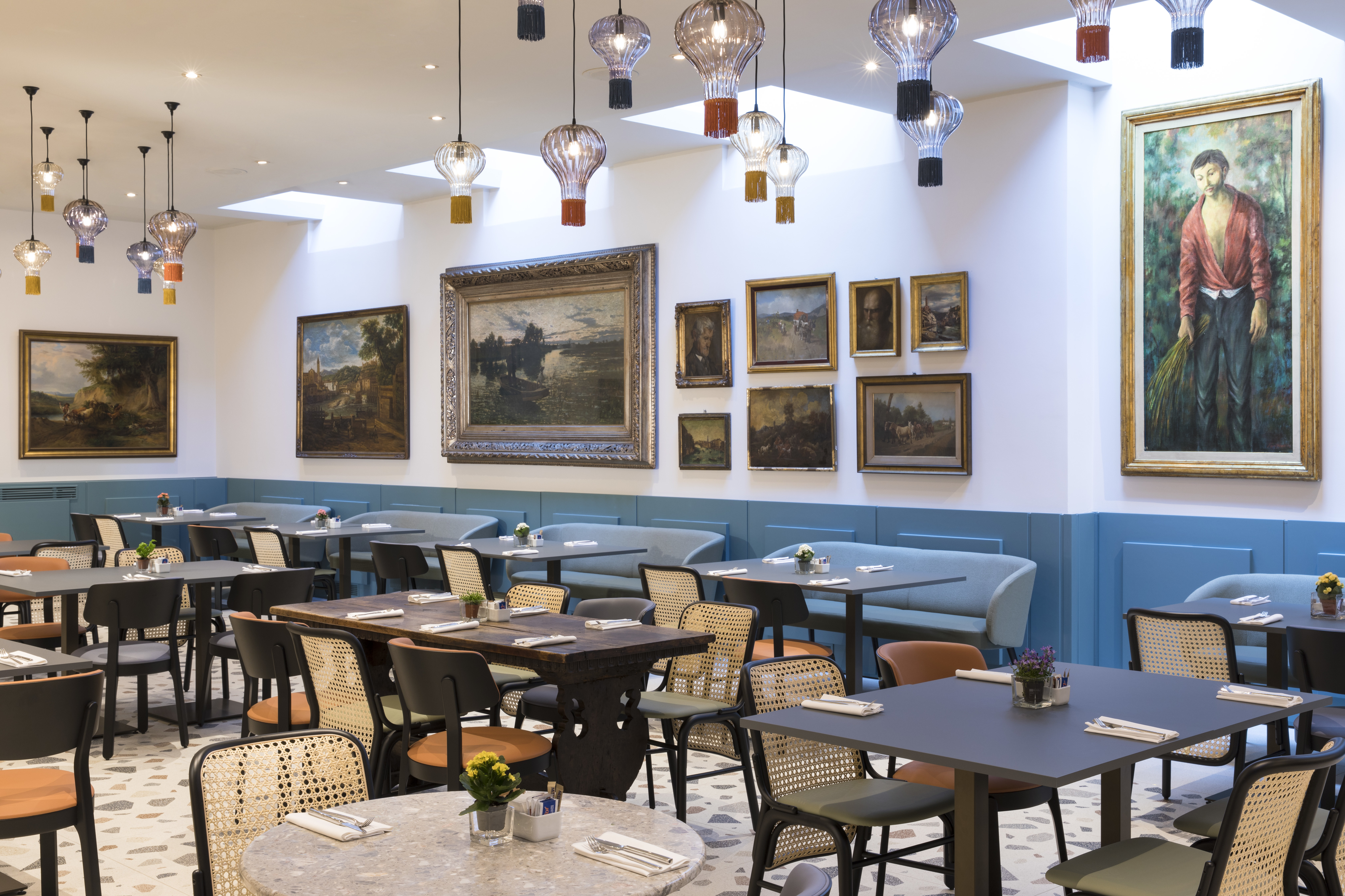 Restaurant with lights hanging from ceiling