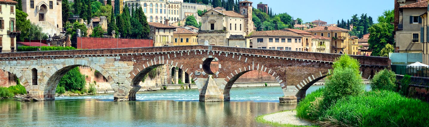 Roman stone bridge over the blue waters of the river Adige in Verona