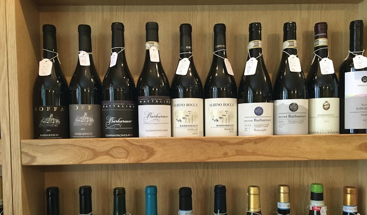 Shleves with wine bottles in Barbaresco Piemonte