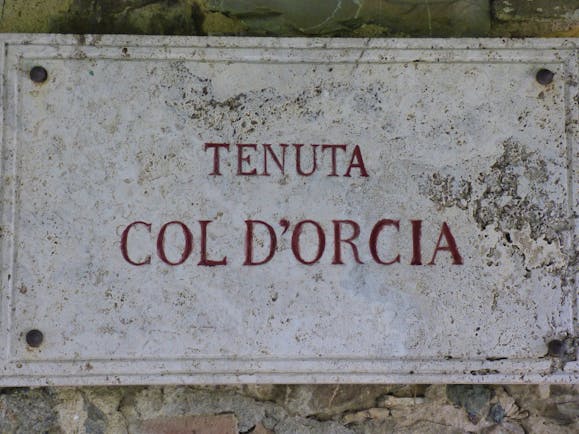 Sign on wall white with red lettering Tenuta Col d'Orcia Tuscany