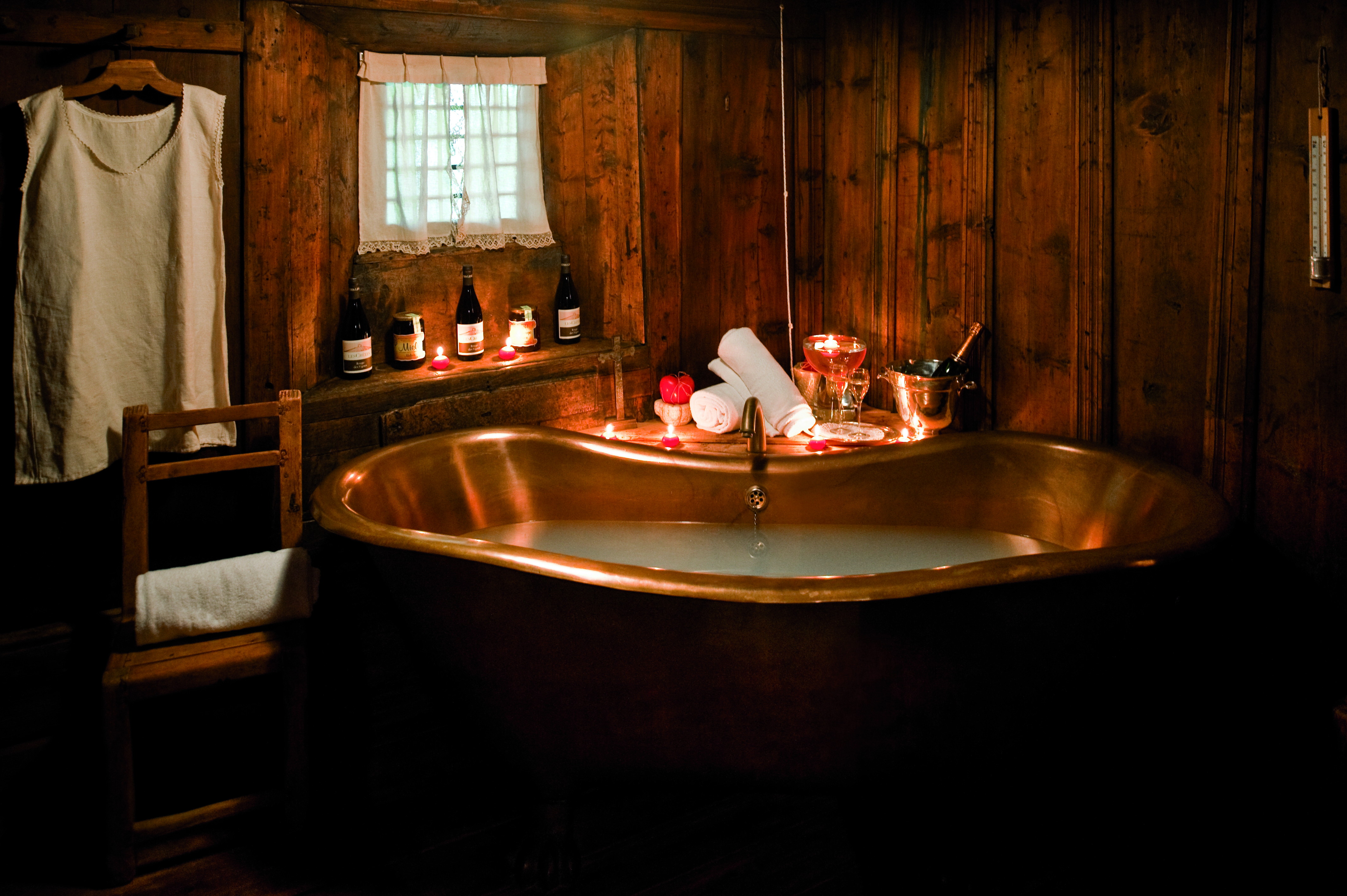 Hotel Bellevue Italy Alps spa bath brass roll top bath candlelit room 