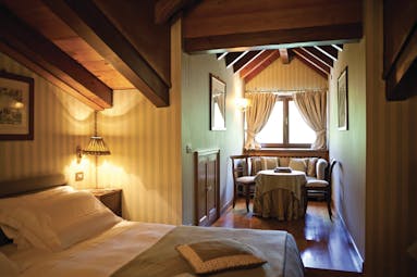 Hotel Hermitage Italy Alps classic  attic room bed seating area