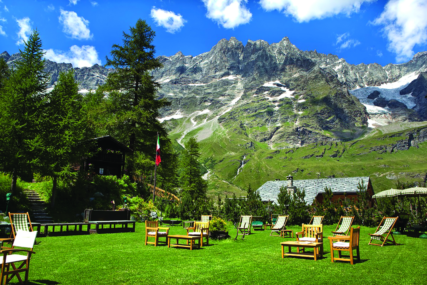 Hotel Hermitage Italy Alps gardens lawn outdoor seating mountains