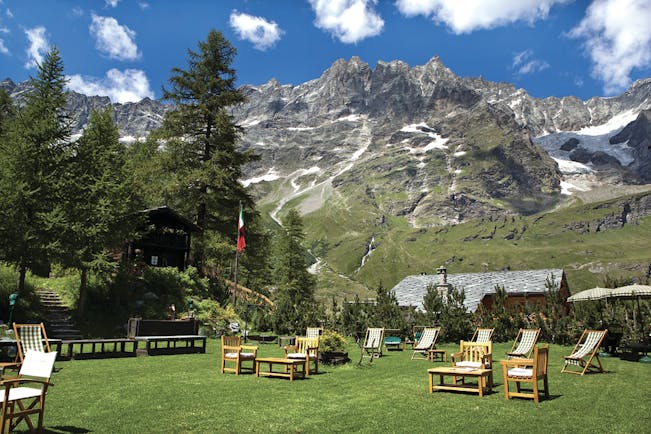 Hotel Hermitage Italy Alps gardens lawn outdoor seating mountains