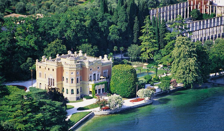 Villa Feltrinelli Lake Garda aerial exterior hotel building lawns trees overlooking lake