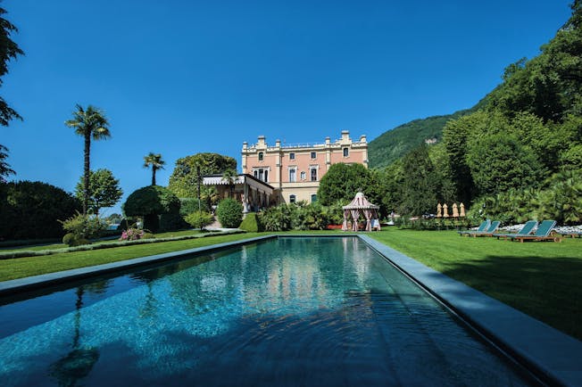 Villa Feltrinelli Lake Garda outdoor pool surrounded by lawns hotel in the background