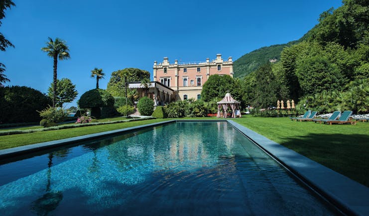 Villa Feltrinelli Lake Garda outdoor pool surrounded by lawns hotel in the background