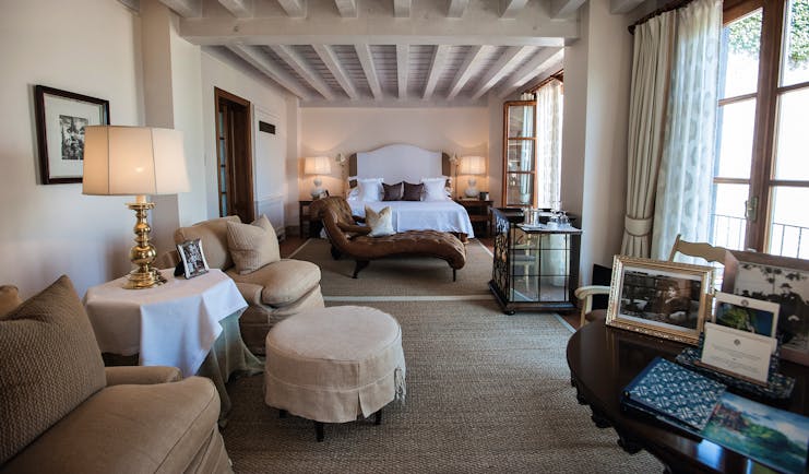 Villa Feltrinelli Lake Garda guest room bed seating area chaise longue elegant décor