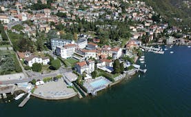 Grand Hotel Imperiale Lake Como aerial shot hotel building pool on the edge of Lake Como
