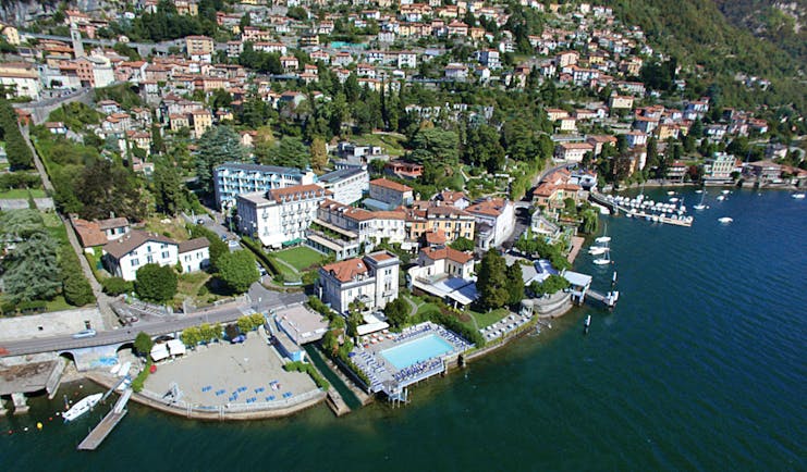 Grand Hotel Imperiale Lake Como aerial shot hotel building pool on the edge of Lake Como
