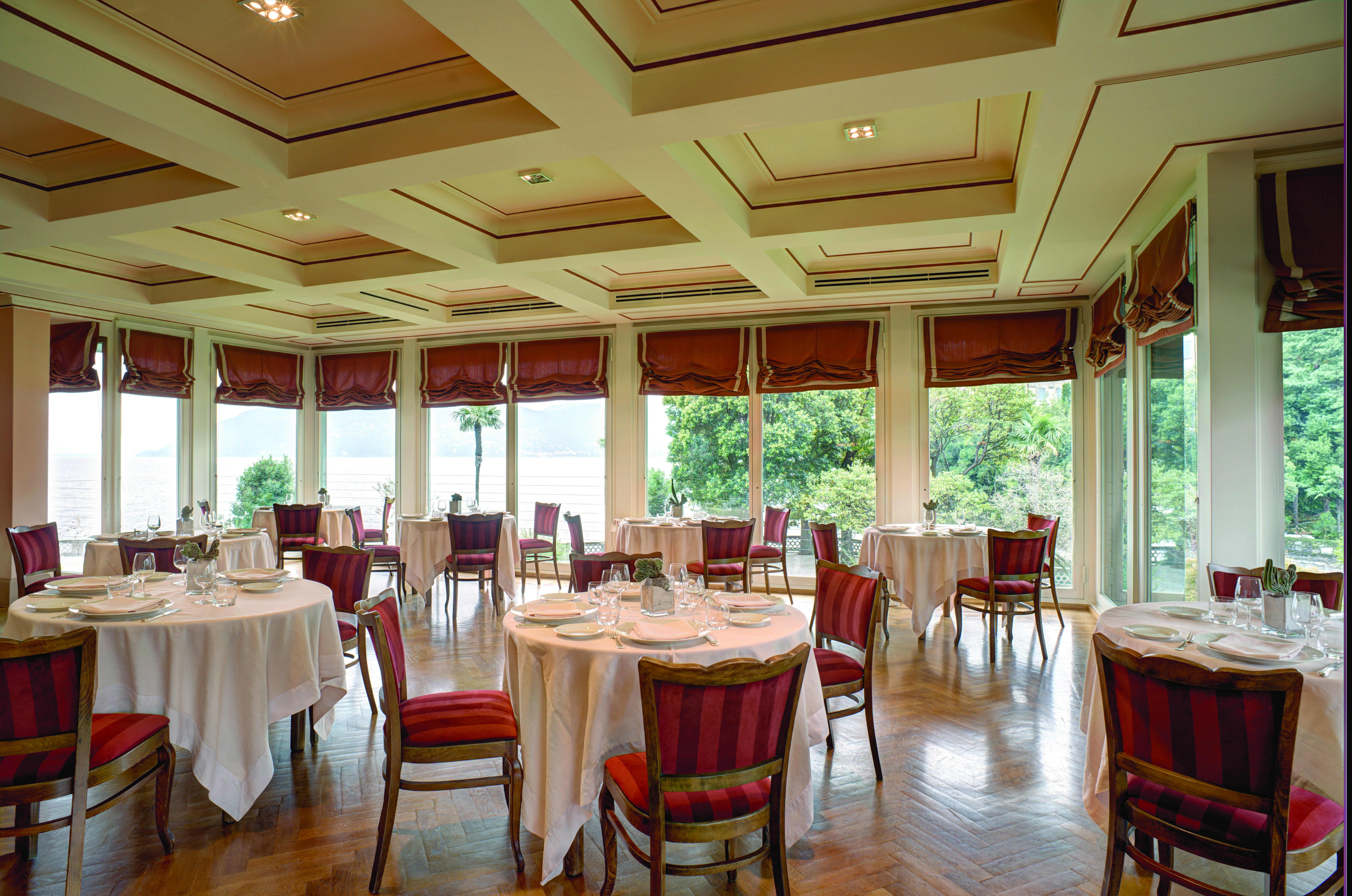 Grand Hotel Majestic Lake Maggiore restaurant indoor dining area traditional décor windows overlooking lake