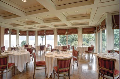 Grand Hotel Majestic Lake Maggiore restaurant indoor dining area traditional décor windows overlooking lake