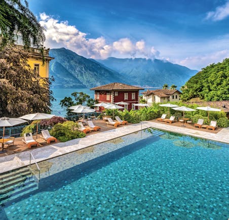 Grand Hotel Tremezzo Lake Como pool sun loungers umbrellas lake in background