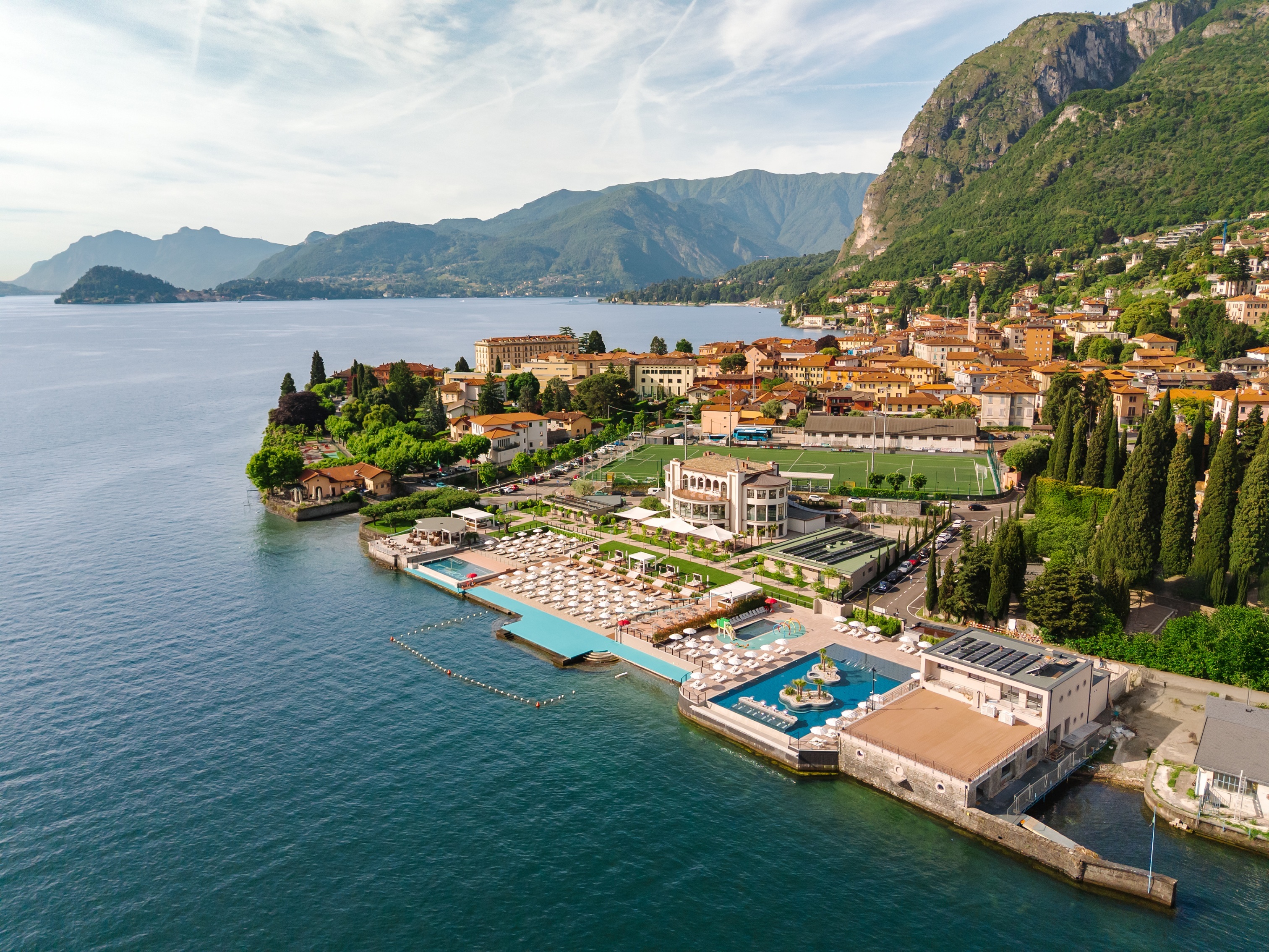 Grand Hotel Victoria Concept & Spa earial view, showing the hotel grounds with pool, gardens, and beach club lake access