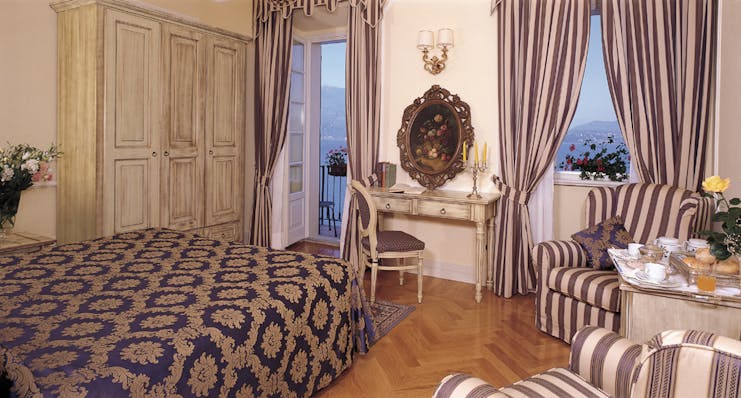 Hotel Cannero Lake Maggiore junior suite interior bed desk armchairs ornate décor