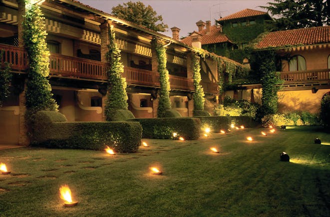 Hotel L'Albereta Lake Iseo gardens at night hotel exterior