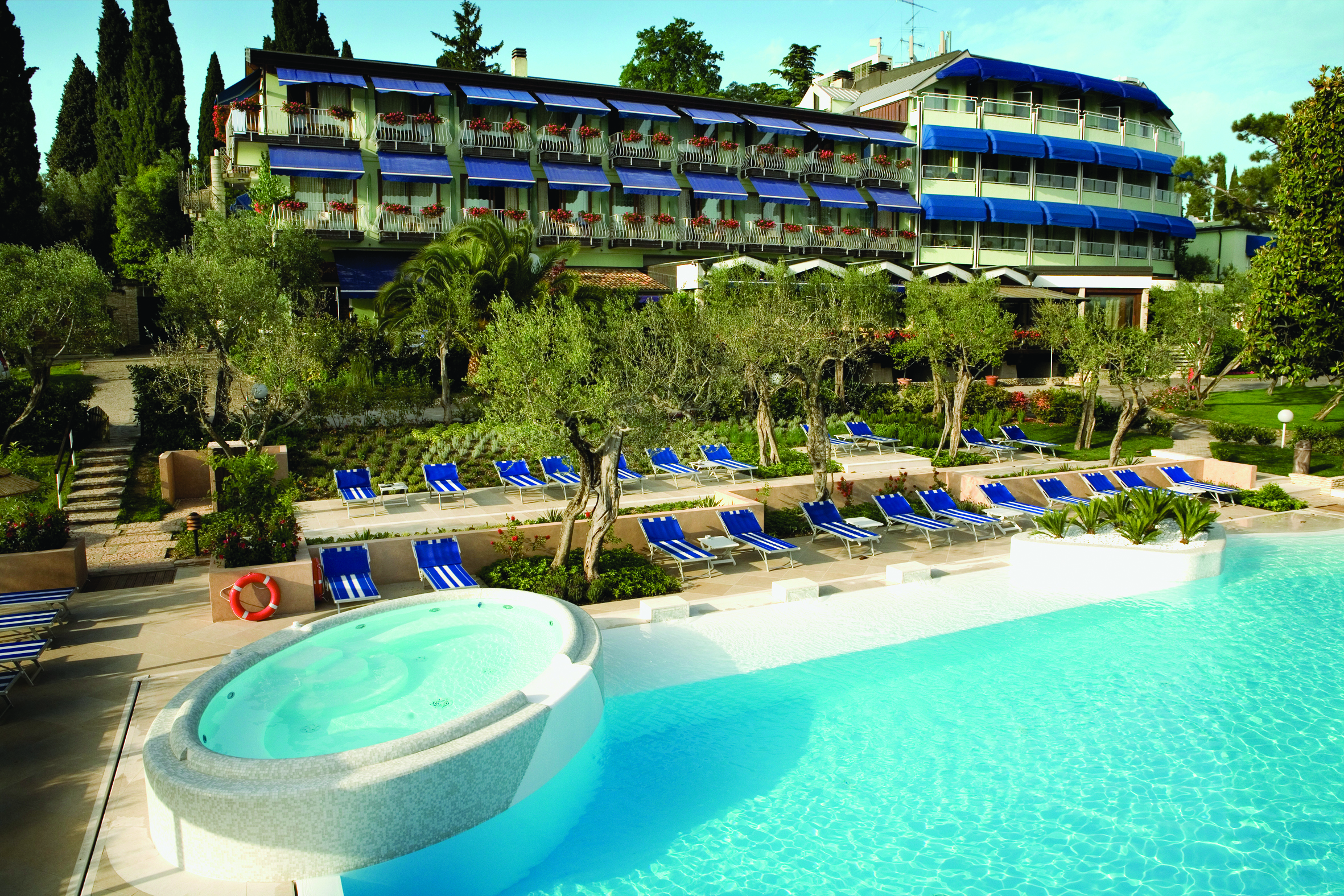 Hotel Olivi Lake Garda exterior hotel and pool sun loungers trees