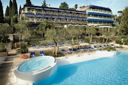 Hotel Olivi Lake Garda exterior hotel and pool sun loungers trees