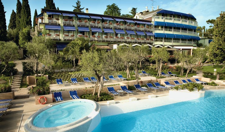 Hotel Olivi Lake Garda exterior hotel and pool sun loungers trees