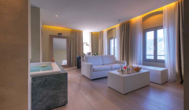 Hotel San Rocco Lake Orta deluxe suite chic minimalist décor stand alone bath tub windows