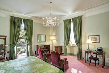 Villa d' Este Lake Como deluxe room traditional décor bed and seating area