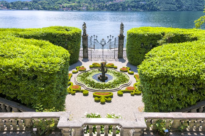 aerial view of fountain and iron gates at villa carlotta on lake como