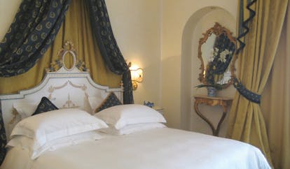 Villa Aminta Lake Maggiore deluxe room canopied bed ornate décor