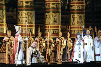 Aida act one men on stage in long white and gold robes