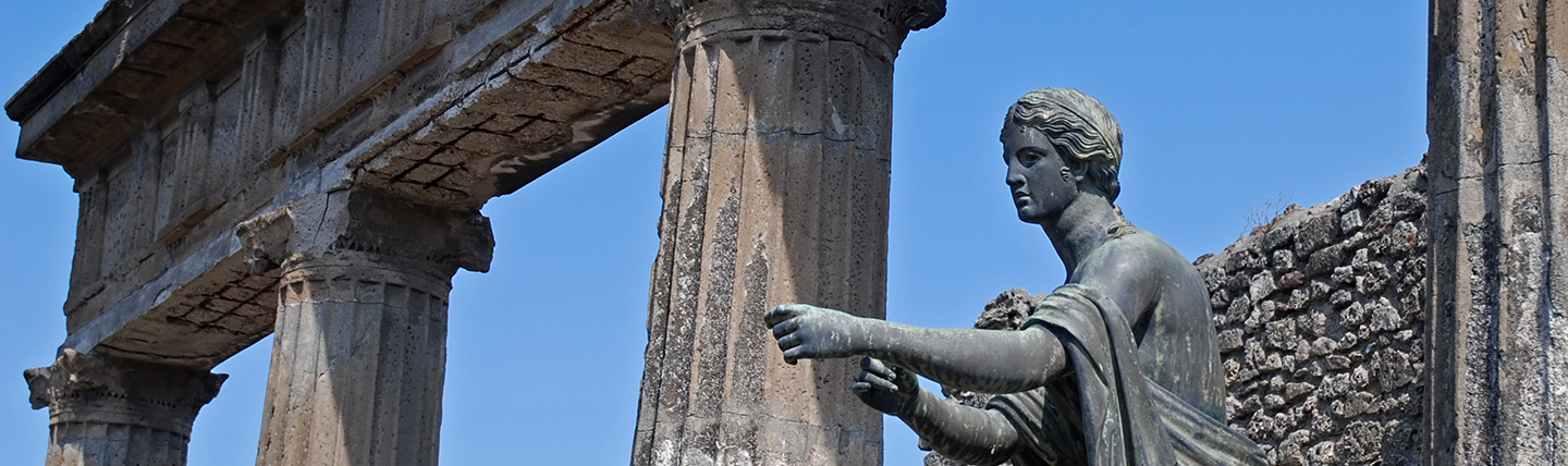 Figure of statue pointing outside roman temple Pompeii