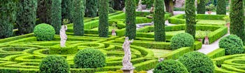 Symmettical gardens of box and cypress with statues in Verona