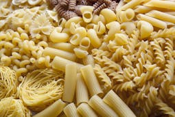 Heap of dry pasta in different shapes